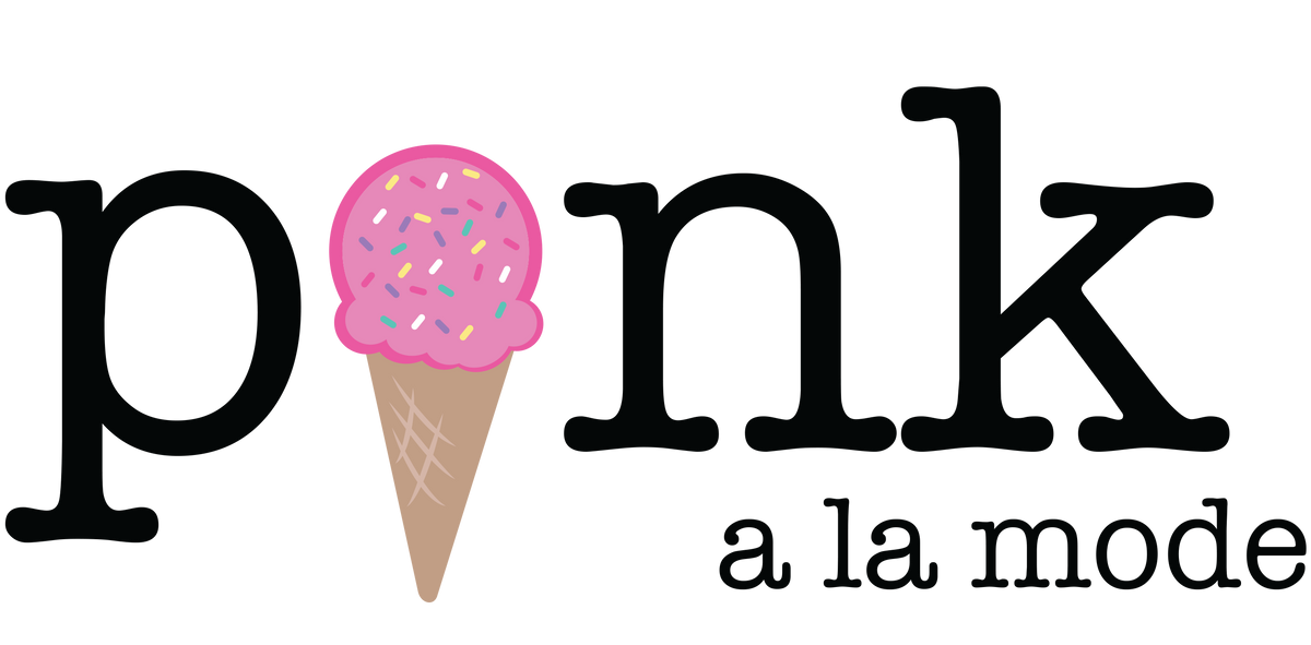 a pink ice cream cone with sprinkles on it